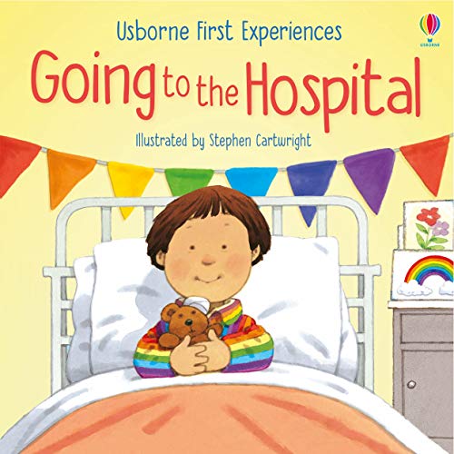 A child in a hospital bed holding a teddy bear, with colorful bunting above.