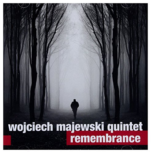 CD cover: lone figure in a misty forest, dark trees.
