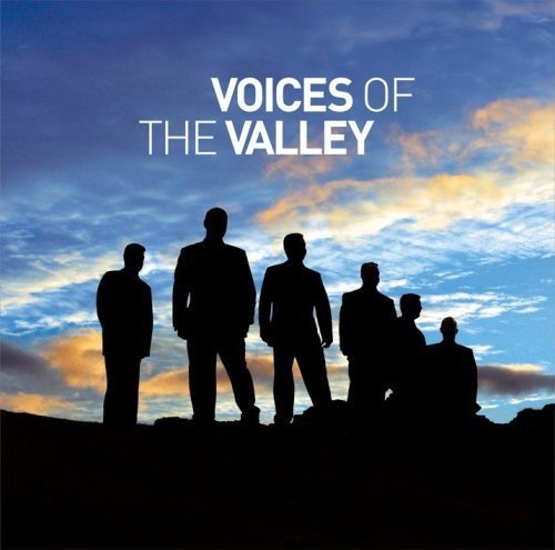 CD cover: Silhouetted male choir against a blue and orange sky.