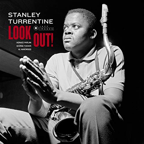 Black and white portrait of Stanley Turrentine with a saxophone.
