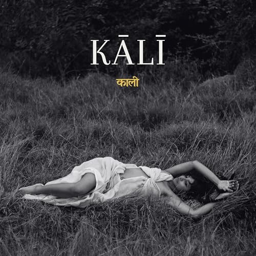 Black and white album cover featuring a person lying in tall grass.