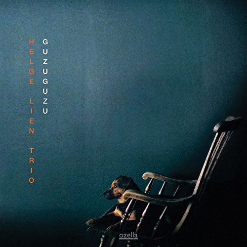 Album cover: dog in rocking chair, dark blue background, text “Guzuguzu”.