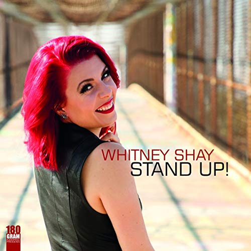 Woman with red hair smiling, album cover for "Stand Up!" vinyl.