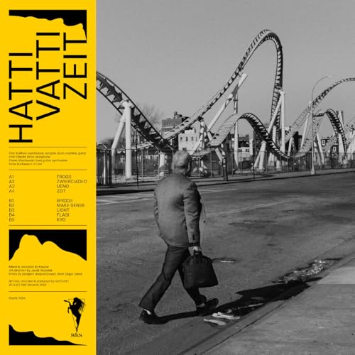 Vinyl album cover: man walking towards a roller coaster in grayscale.
