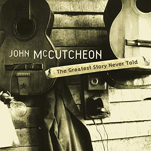 CD cover with guitars and text: “John McCutcheon - The Greatest Story Never Told.”