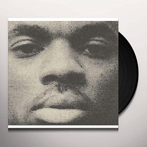 Black and white halftone portrait of Vince Staples with vinyl record.