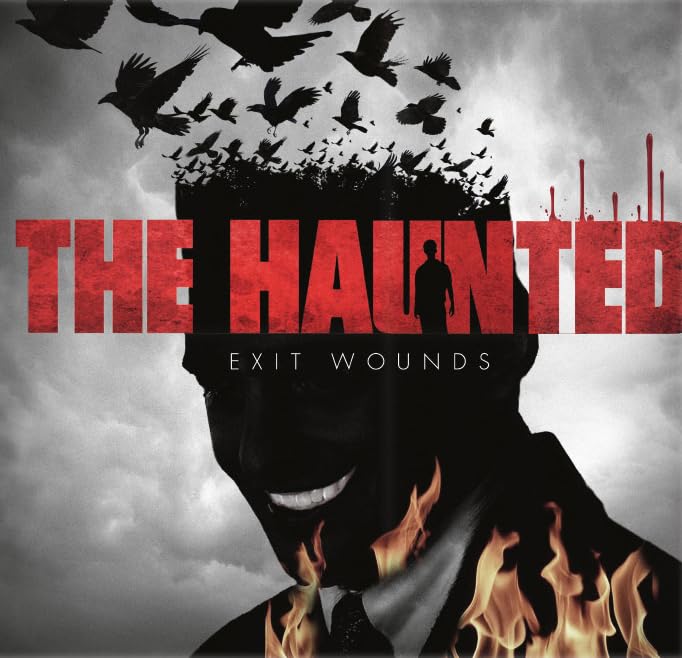 Album cover for "The Haunted" featuring a silhouetted face and flock of birds.