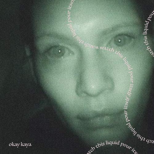 Close-up of a person's face with text circling, dark green background.