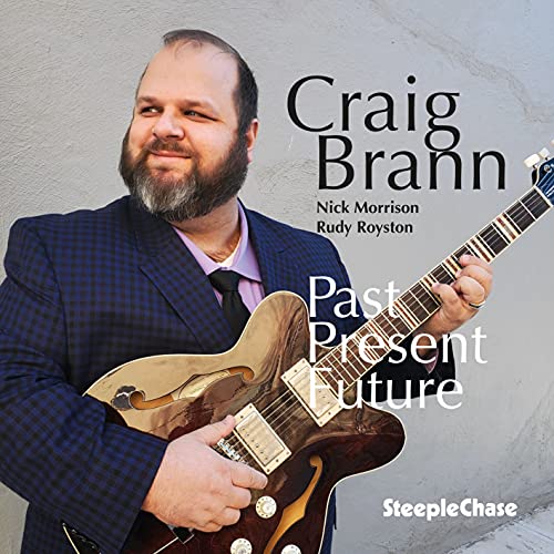 Craig Brann, a bearded musician with a guitar, album cover art.
