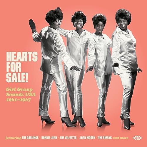 Album cover: four women in matching suits, 1960s style, pink background.