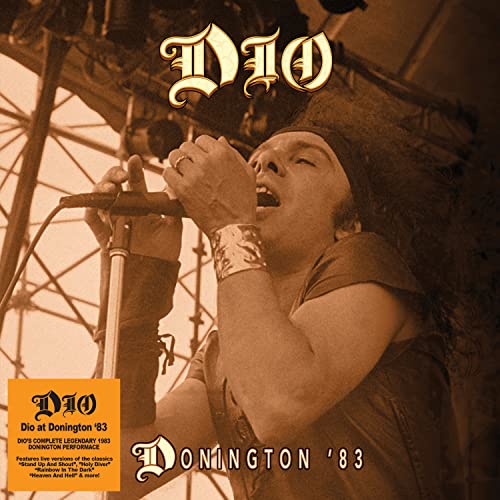 Ronnie James Dio singing into a microphone at Donington '83 concert.