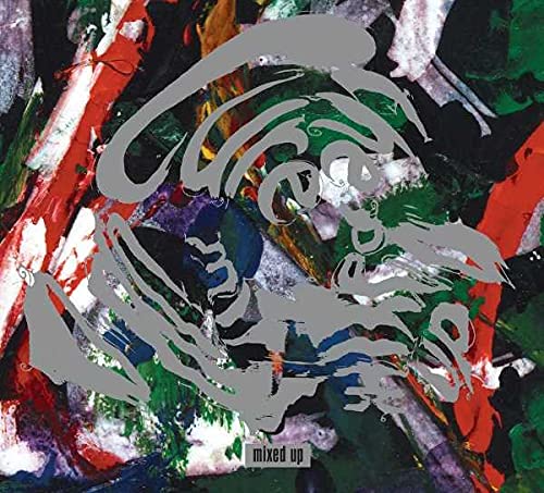 The Cure “Mixed Up” CD cover with abstract paint strokes and logo.
