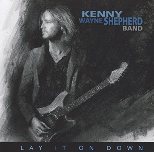Kenny Wayne Shepherd album cover featuring a guitarist with his guitar.