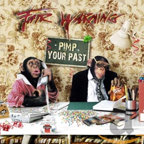 CD cover: two monkeys in suits at a desk, floral wallpaper.