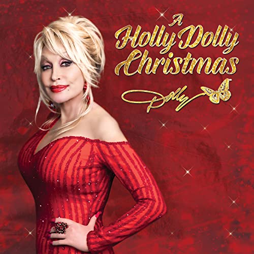 Dolly Parton in red, smiling for her "A Holly Dolly Christmas" album.