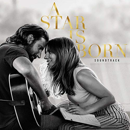 Black and white photo of Bradley Cooper and Lady Gaga looking at each other.