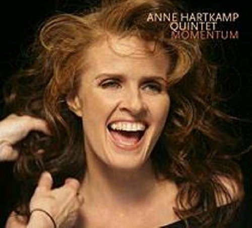 CD cover featuring a smiling red-haired woman, Anne Hartkamp Quintet.