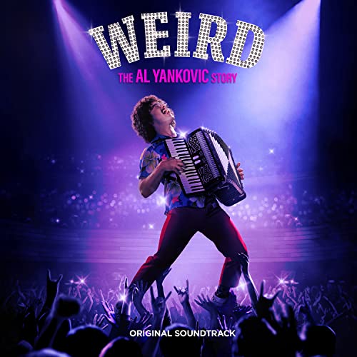 Weird Al Yankovic playing an accordion on stage with a crowd.