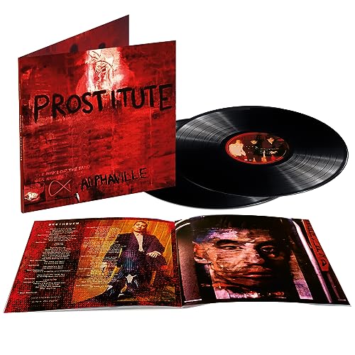 Vinyl record and cover with red and black design, man’s face and suit images.
