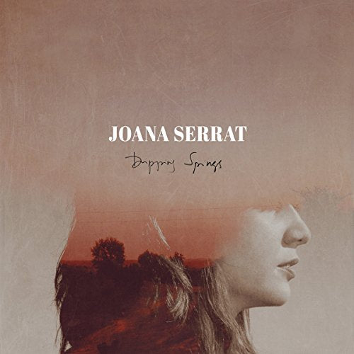 Vinyl record cover featuring Joana Serrat’s face and a landscape silhouette.