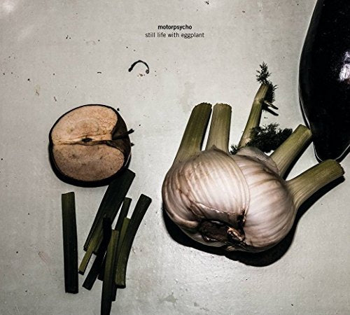 CD cover: eggplant, garlic, and scallions on a textured gray surface.