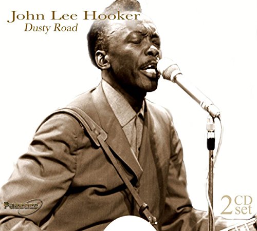 Sepia-toned portrait of John Lee Hooker singing into a microphone.