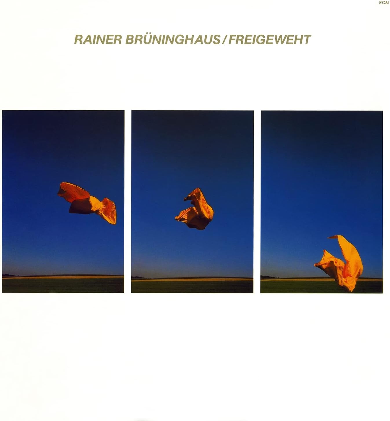 Vinyl album cover: three panels showing orange paper flying in a blue sky.