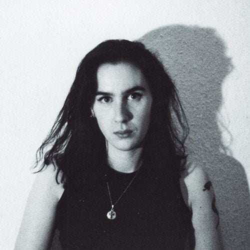 Black and white portrait of a person with long dark hair.