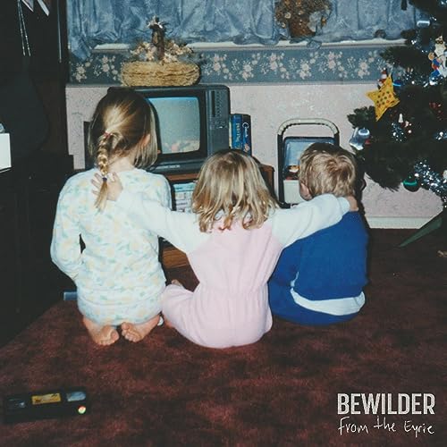 Children watching a vintage television in a decorated room.
