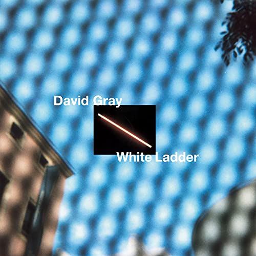 David Gray’s “White Ladder” album cover with a blurred blue background.