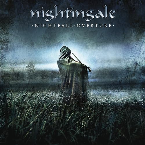 CD cover: hooded figure in a misty, desolate landscape.