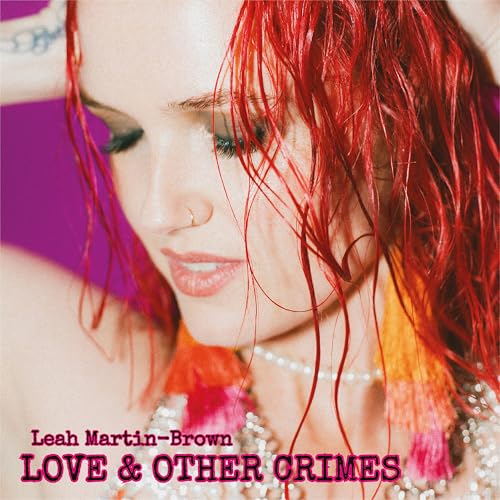 CD cover featuring red-haired woman with text “Love & Other Crimes”.