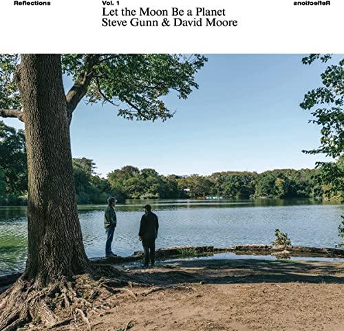 Album cover: lakeside scene with two figures and trees.