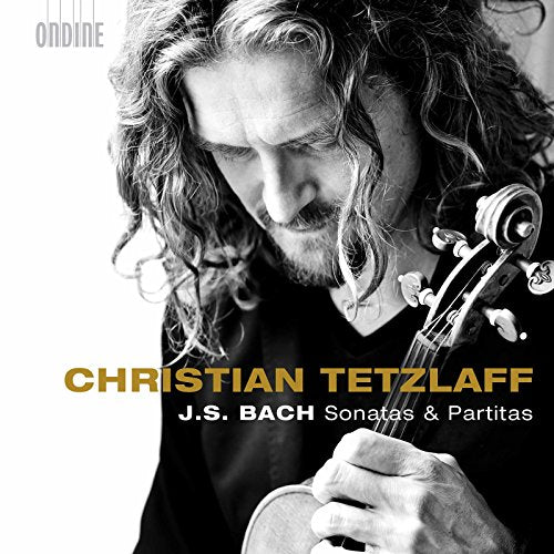 Black and white portrait of violinist Christian Tetzlaff with his instrument.
