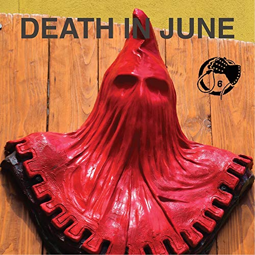 Red hooded figure sculpture with skull face, album cover art.