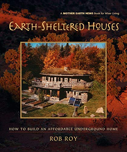 Book cover showing a stone earth-sheltered house with a green roof in autumn woods.