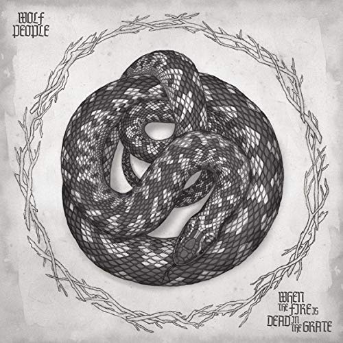 Black and white illustration of a coiled snake within a thorny wreath.