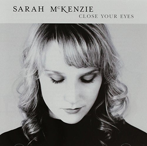 CD cover: black and white portrait of Sarah Mckenzie with closed eyes.