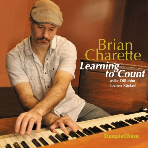 CD cover: Brian Charette at an organ, wearing a newsboy cap.