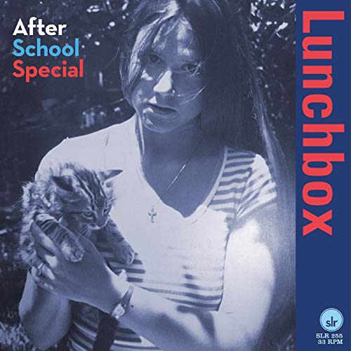 Vinyl record cover: woman holding a kitten, blue and red text.