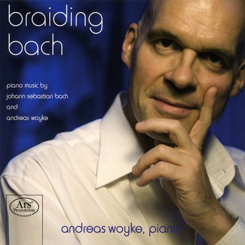 CD cover featuring pianist Andreas Woyke with blue background.