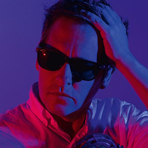Josh Rouse album cover with a man in sunglasses, blue and pink lighting.