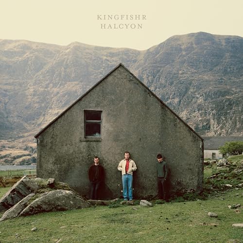 CD cover: three men stand before a small, stone house in mountains.
