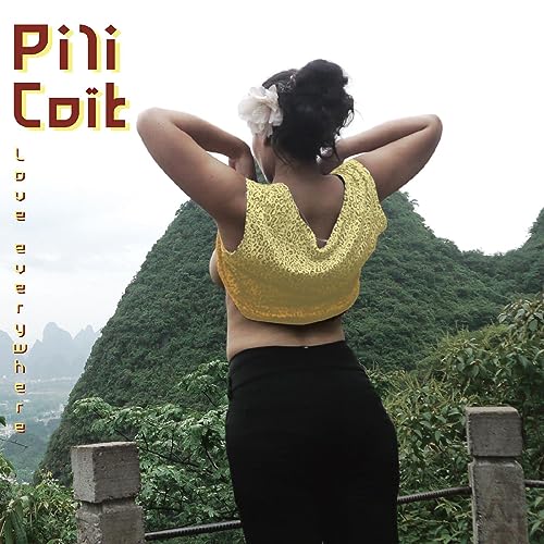 Woman with flower in hair, facing mountainous landscape, album cover.
