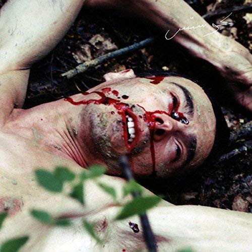 Album cover: man with bloodied face lying on the ground.