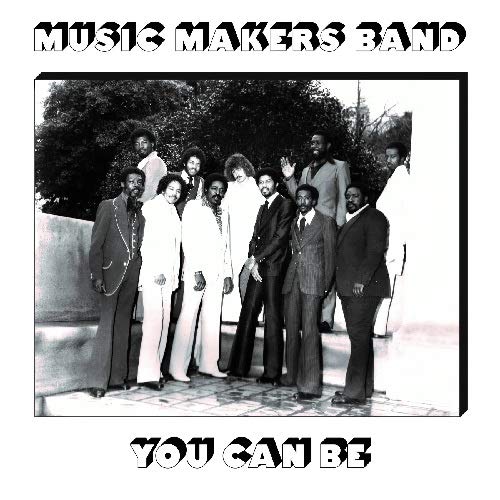 Black and white photo of a nine-member band in suits.