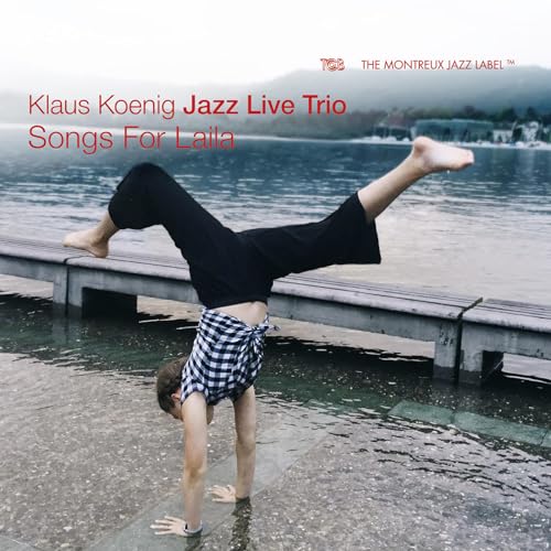 CD cover: person doing a handstand by a lake, text overlay.