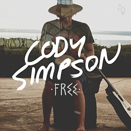 Cody Simpson album cover, featuring a seated artist with a guitar.
