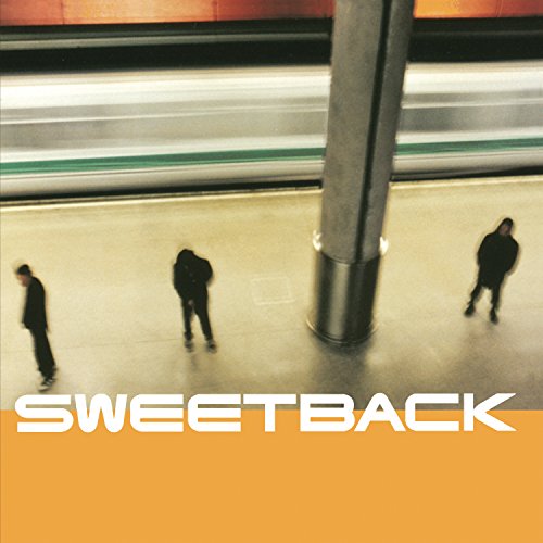 Vinyl album cover with blurred figures in a subway station.