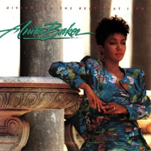 Anita Baker album cover, portrait of singer in floral jacket.